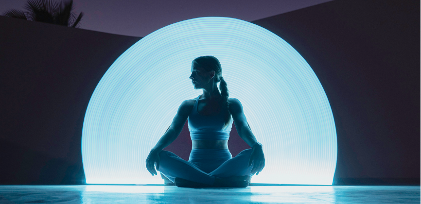 A woman sitting in a lotus position